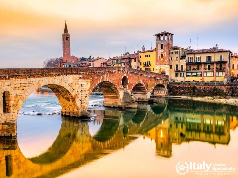 Scenery with Adige River and Ponte di Pietra, Verona, Italy. 