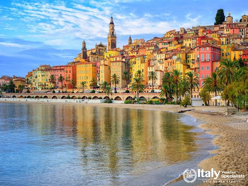 Sand Beach Beneath the Colorful Old Town Menton on French Riviera, France