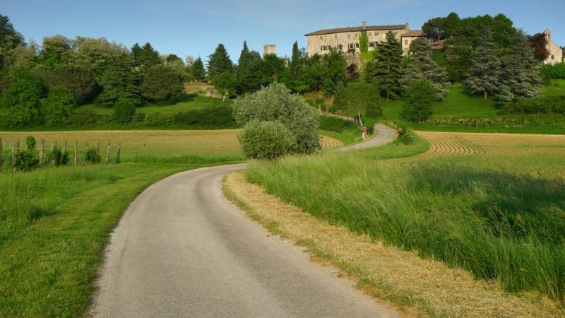 Friuli-Venezia Giulia, Italy - Bending road leading to Arcano castle near Udine,