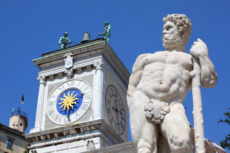 Udine, Italy - Clock Tower and statue in Piazza della Libertia