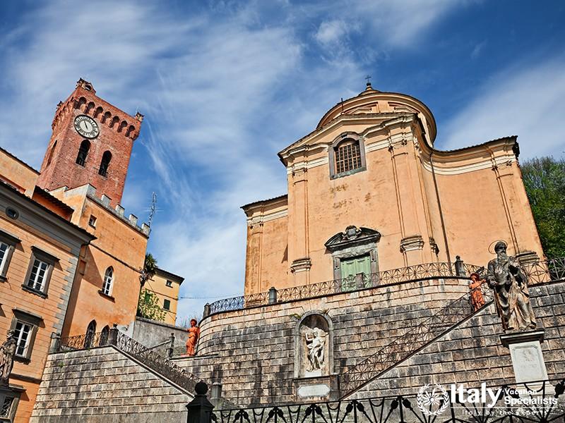 Church of the Holy Cross and medieval tower of Matilda in the ancient Tuscan village