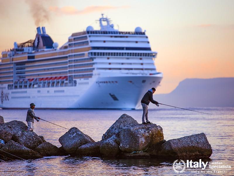 Ship heading to the harbor, sunrise above the sea