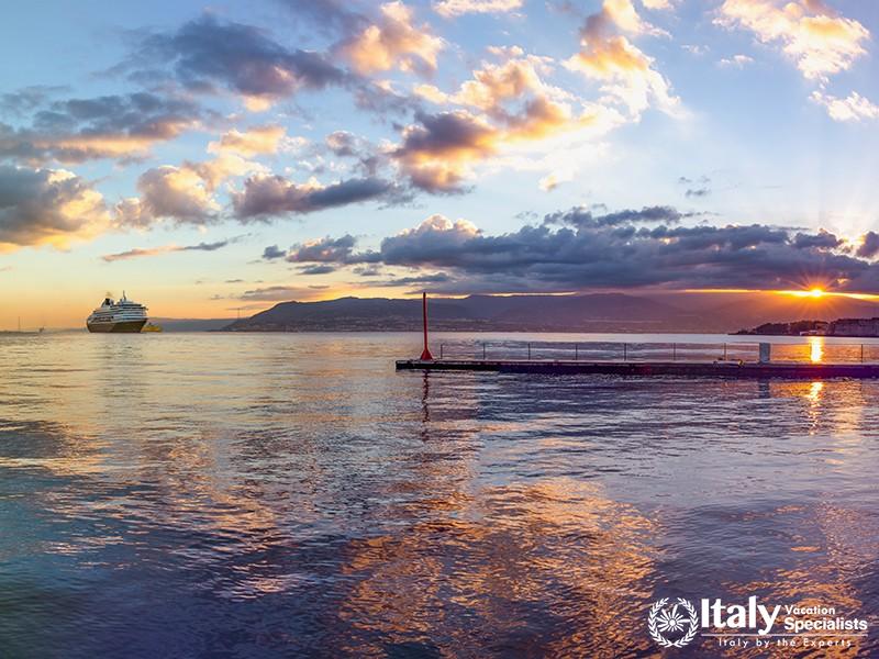 Messina, Sicily  Italy Ship heading to the harbor, sunrise above the sea