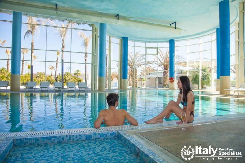 Indoor swimming pool in MH Matera Hotel