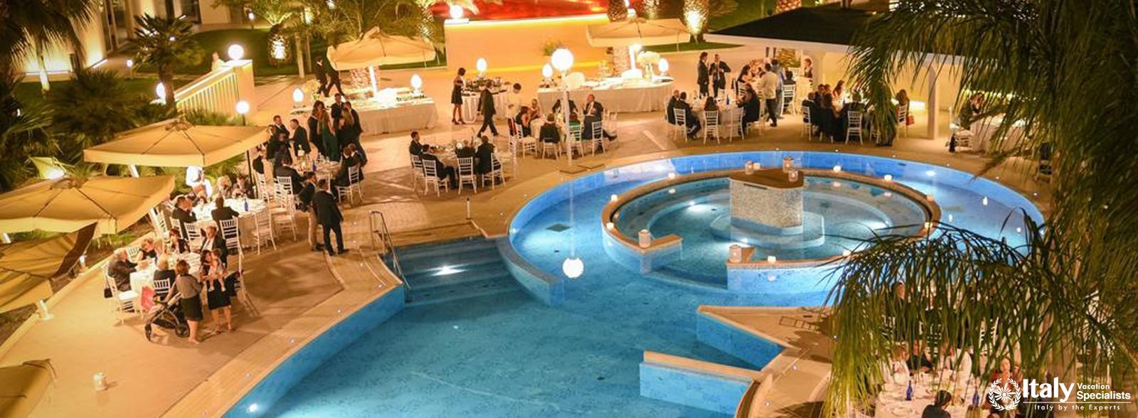 Outdoor swimming pool in MH Matera Hotel