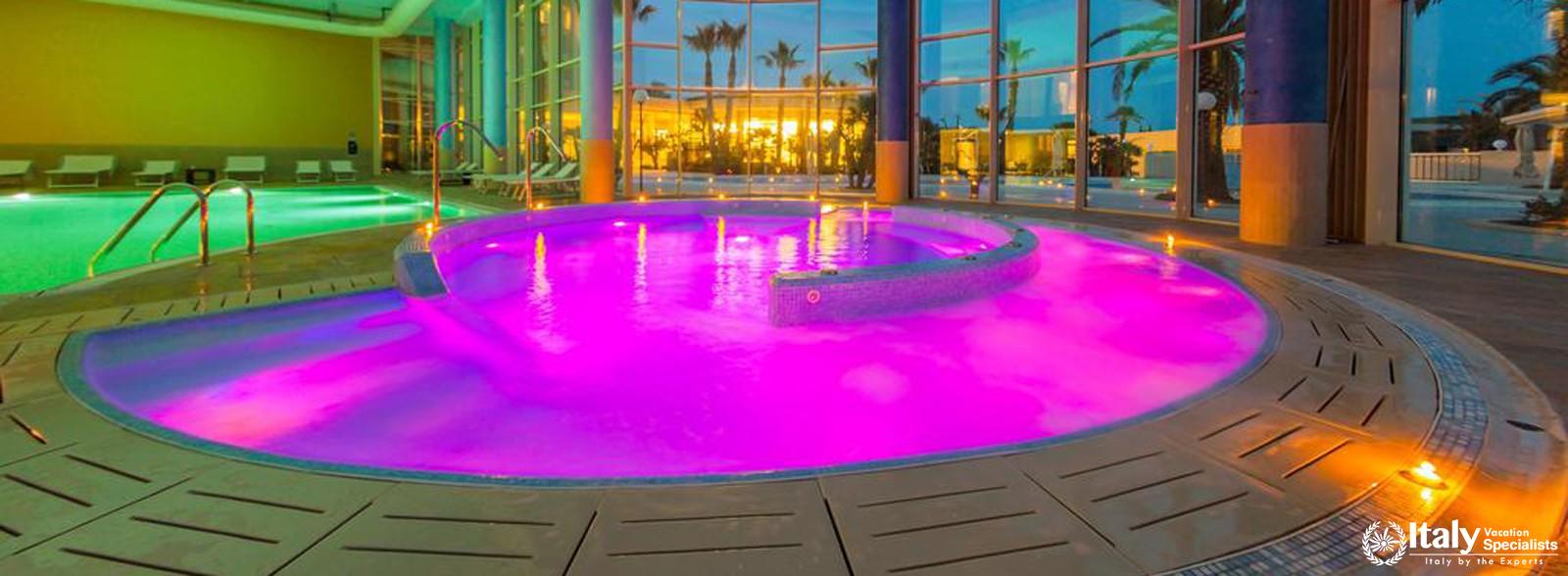 Indoor swimming pool in MH Matera Hotel