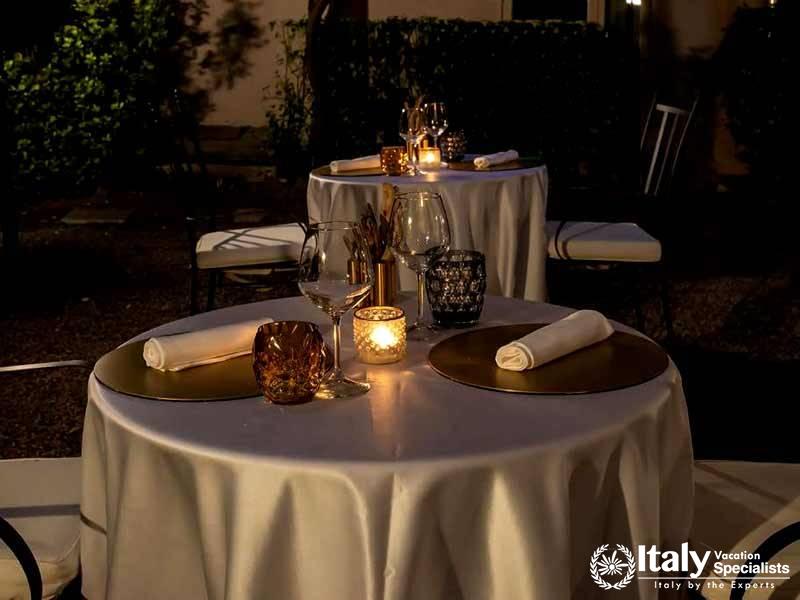 Peaceful Dinning Area with the Candles on the Table in Donna Camilla Savelli