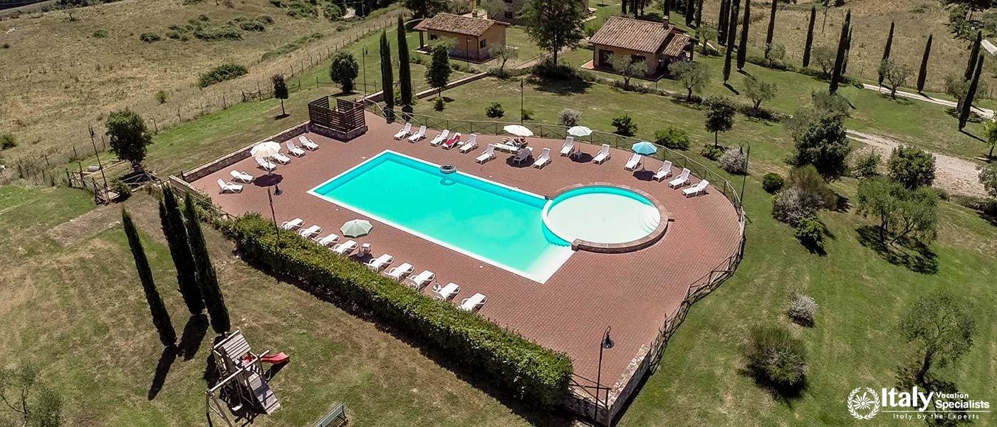 Tranquil pool area set within beautiful garden landscapes at Park Hotel Ai Cappuccini.
