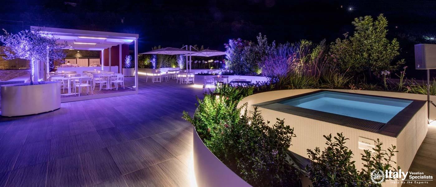 Elegantly lit outdoor dining area for an enchanting evening at Park Hotel Ai Cappuccini.