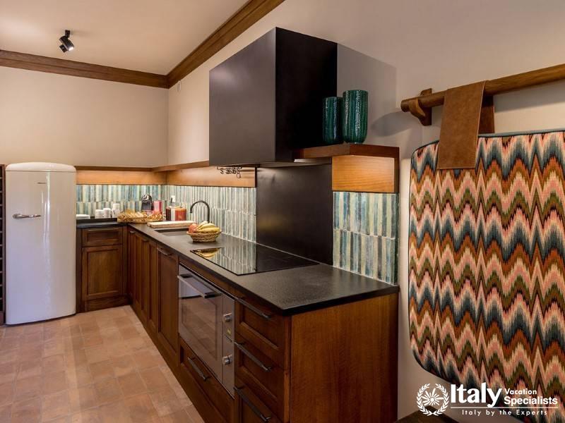 Vibrant and modern kitchen setup with a retro fridge and colorful accents.
