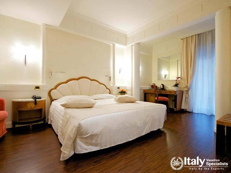 Spacious Bedroom with Balcony Access at Mercure Parma Centro Stendhal in Parma, Italy