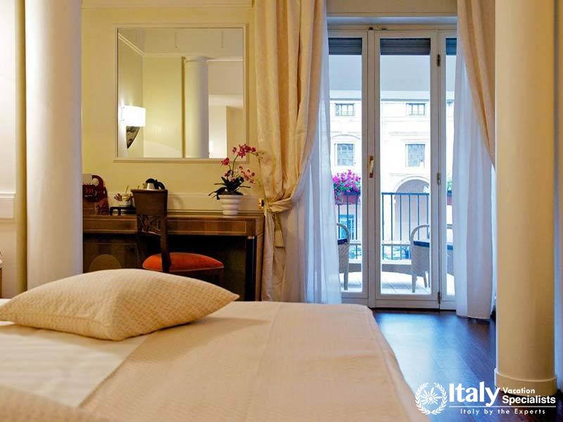 Spacious Bedroom with Balcony Access at Mercure Parma Centro Stendhal in Parma, Italy