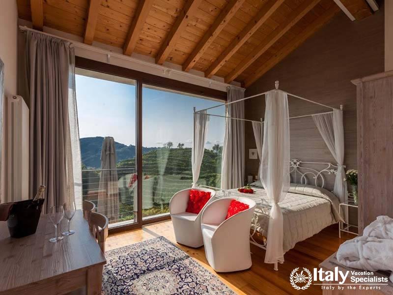 Traditional Rustic Bedroom at Agriturismo Due Carpini in Valdobbiadene, Italy