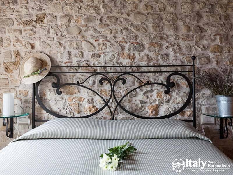 Cozy Stone Wall Bedroom at Agriturismo Due Carpini in Valdobbiadene, Italy