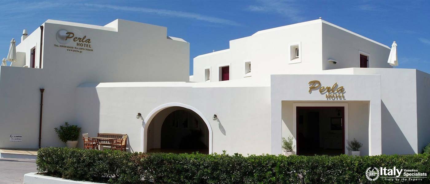 The charming exterior of Perla Hotel in Naxos, Greece