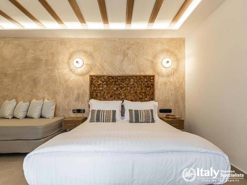 Elegant bedroom design with modern touches at Perla Hotel in Naxos, Greece