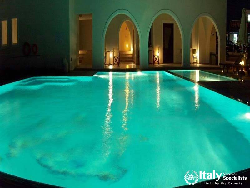 The serene swimming pool area at Perla Hotel in Naxos, Greece