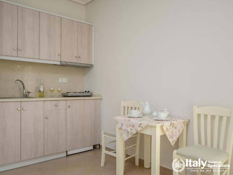Simple and inviting kitchenette area at Perla Hotel in Naxos, Greece