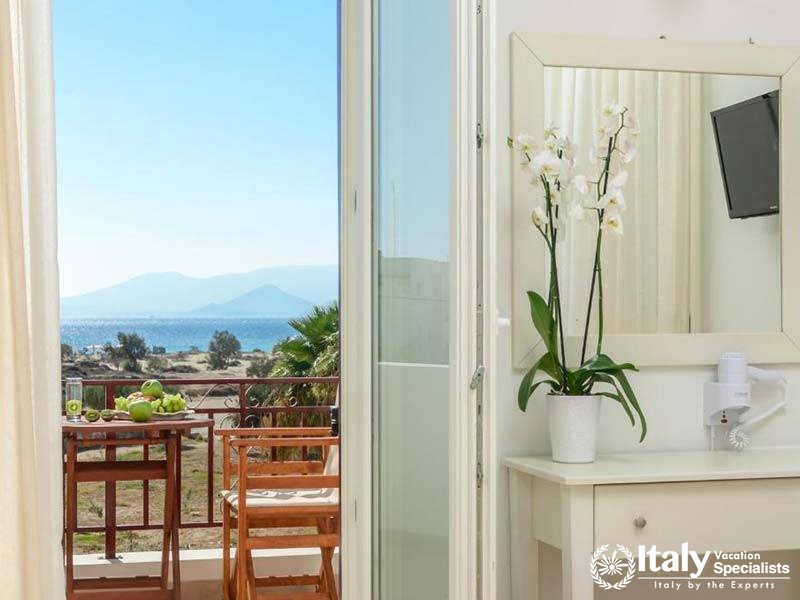 Beautiful balcony view with seating at Perla Hotel in Naxos, Greece