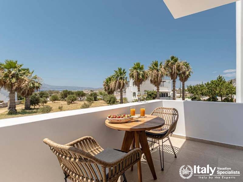 Relaxing outdoor seating with a view at Perla Hotel in Naxos, Greece