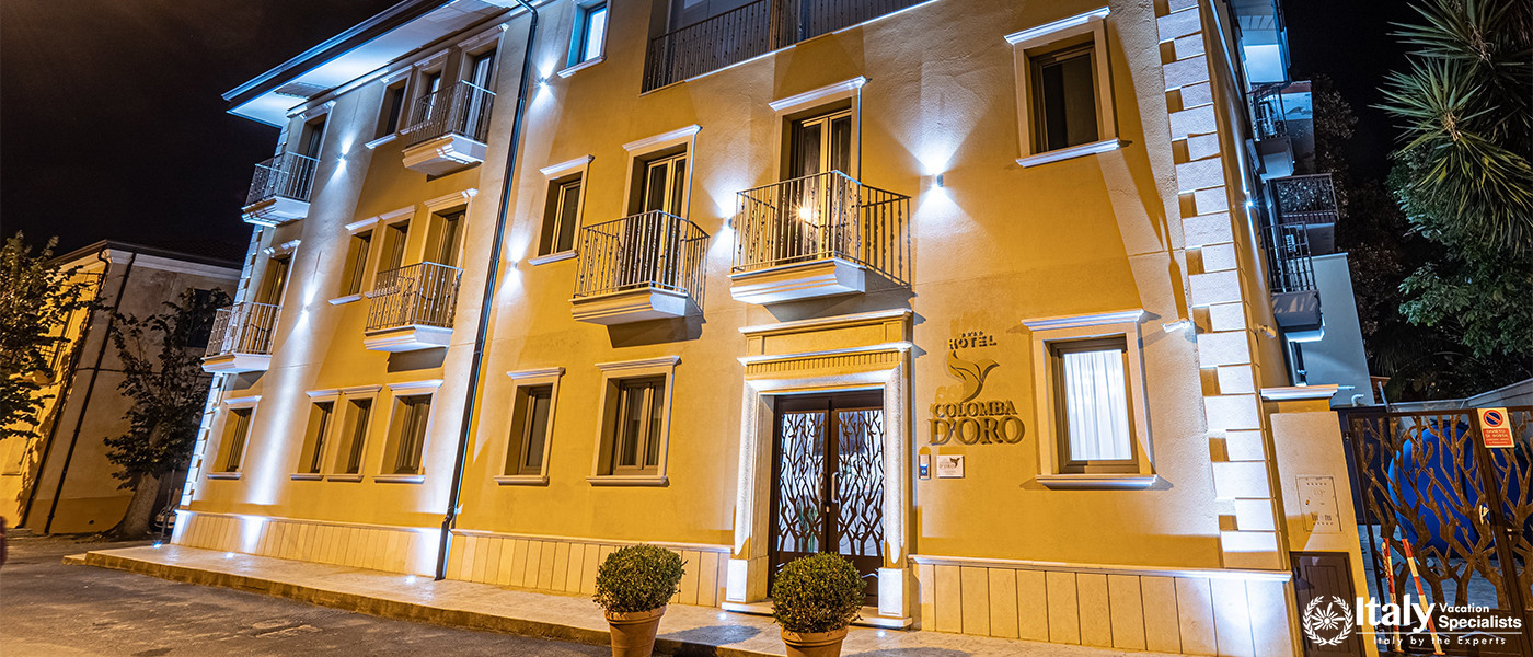Exterior view of Hotel Colomba D'Oro in Tropea, Italy at night