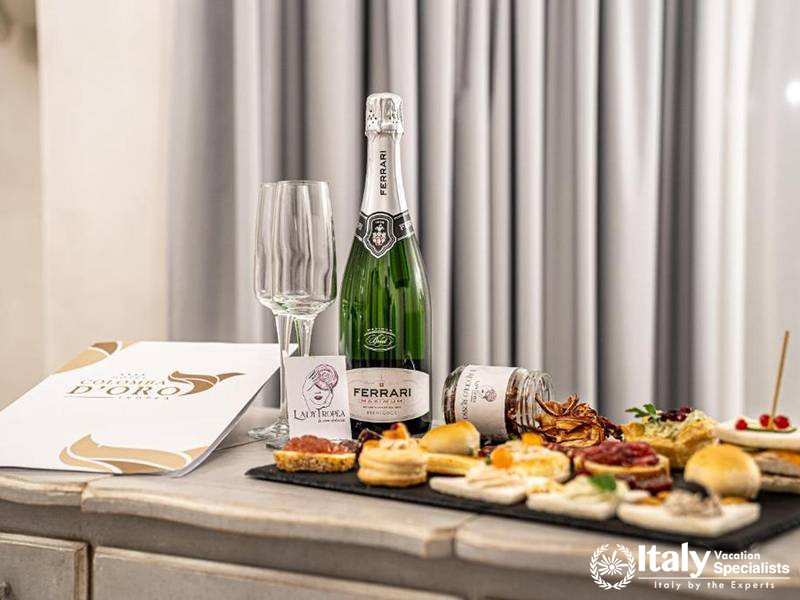 Delicious Wine and Pastry Spread at Hotel Colomba D'Oro in Tropea, Italy