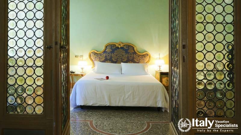 Elegant bed in the suite of Hotel Locarno
