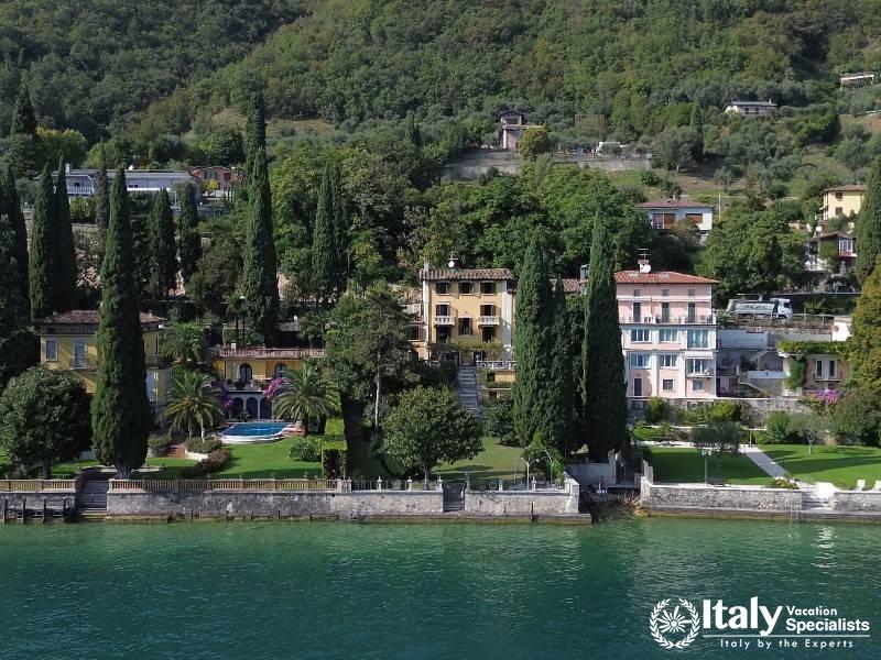 Lakefront Luxury: A grand lakeside estate with manicured gardens and a private pool Near Lake Garda