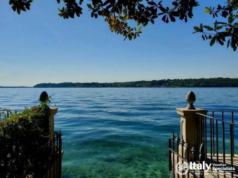 Serene Lakeside Gateway: A tranquil lakeside entrance framed by nature\s calmness near Lake Garda