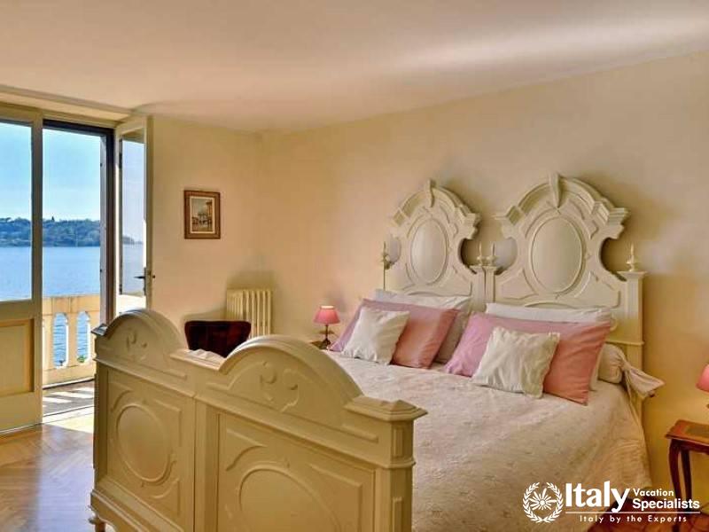 Lakeview Serenity: bedroom opens to a balcony with breathtaking views of lake near Lake Garda