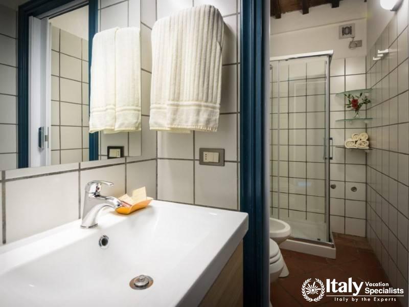 Clean and modern bathroom with a walk-in shower and neat tile work.