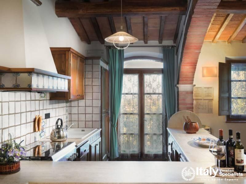 Well-equipped kitchen with a picturesque window, ideal for preparing gourmet meals.