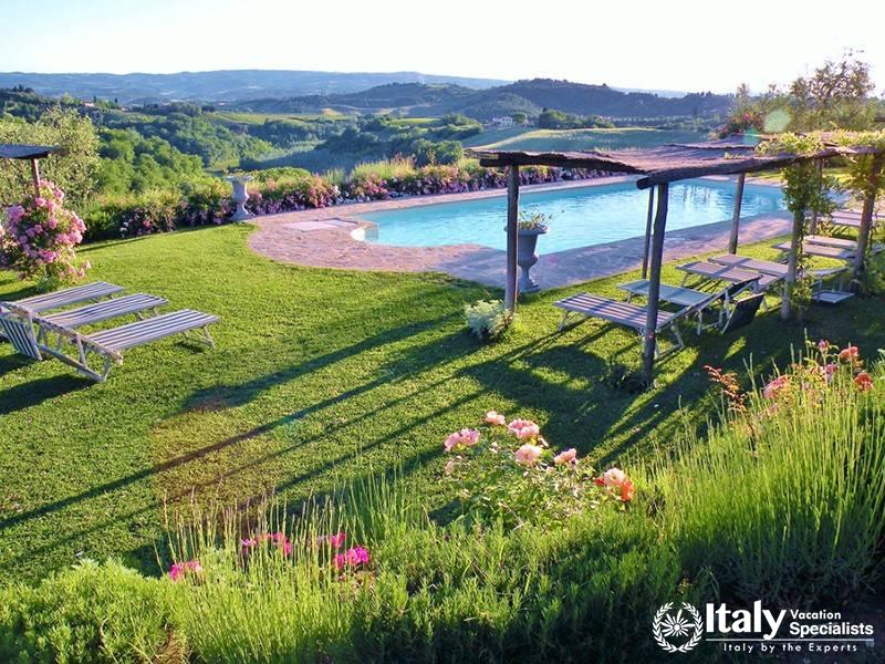 Poolside relaxation with panoramic views near Florence, Italy.