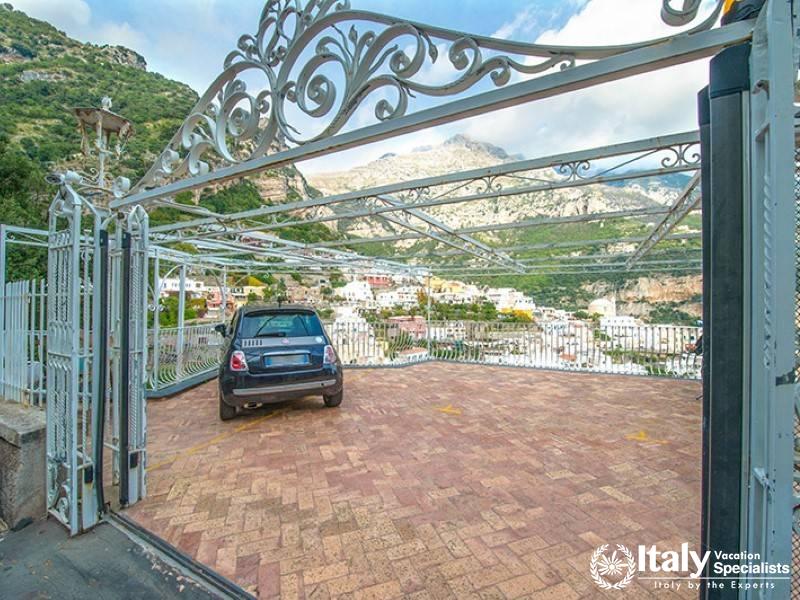 A spacious private parking area with scenic views of Positano.