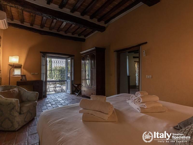 Inviting bedroom with private patio access and natural light.