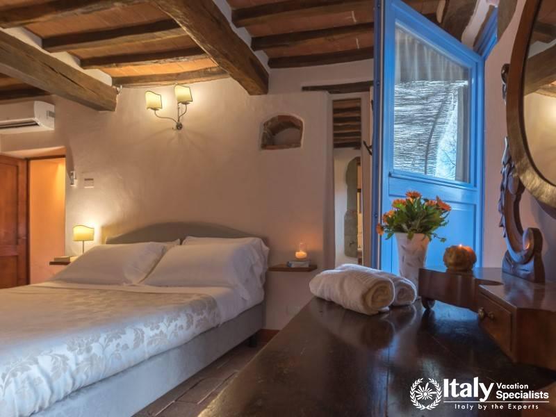 Tasteful bedroom with a touch of rustic elegance.