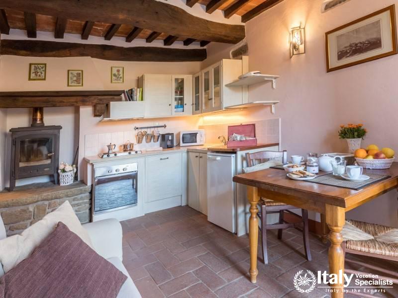 Fully equipped kitchen with rustic charm and modern amenities.