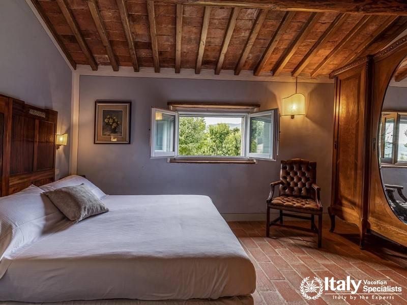 Spacious Bedroom: Bright and airy bedroom with a rustic touch.