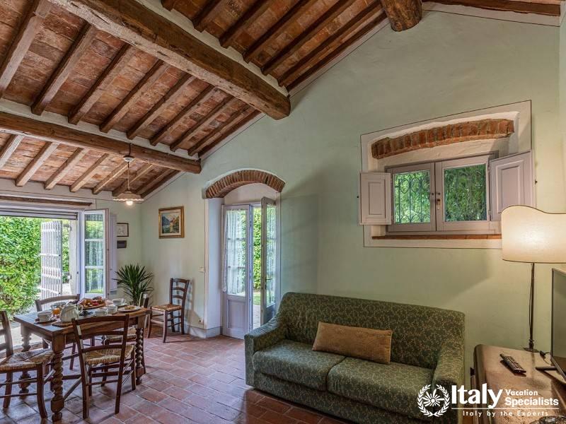 Living and Dining Space: Inviting living and dining area with garden views.