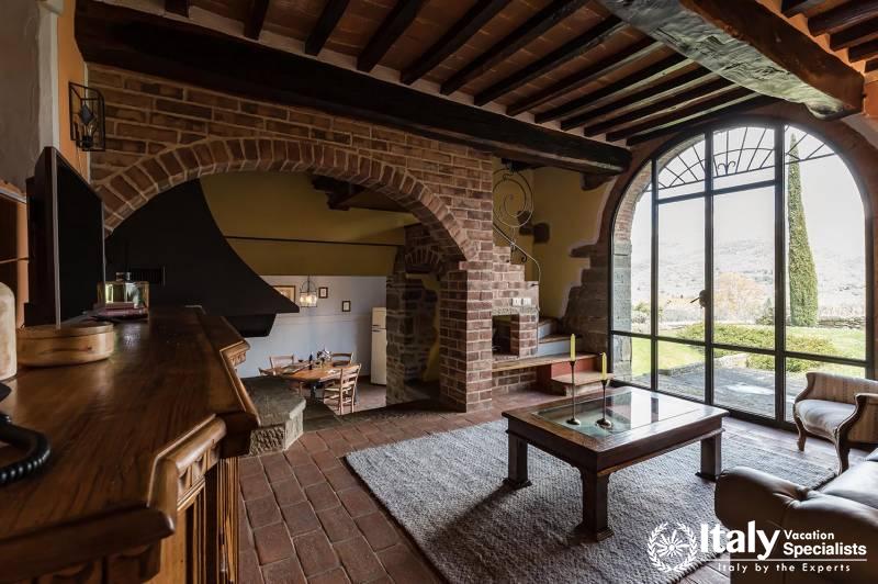 Cozy Living Room: Relax in a cozy living room with large windows.