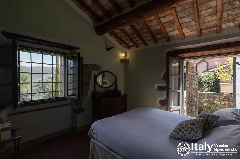 Bedroom View: Wake up to stunning views in a quaint bedroom.