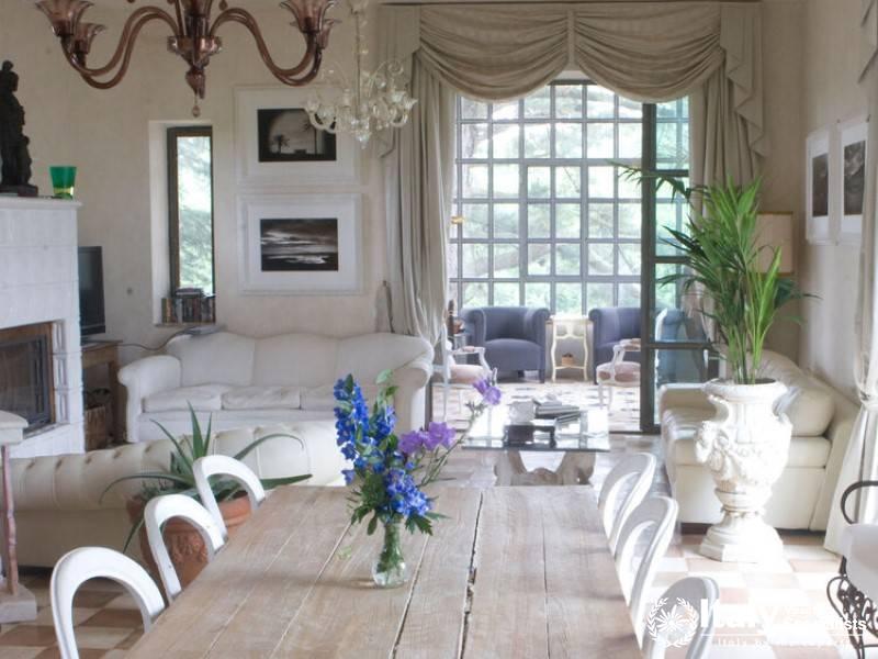 Bright living area with elegant decor and large windows.