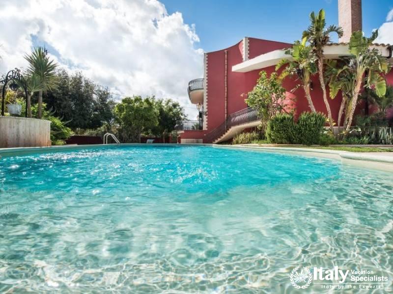 Inviting private pool with crystal-clear water and lush surroundings.