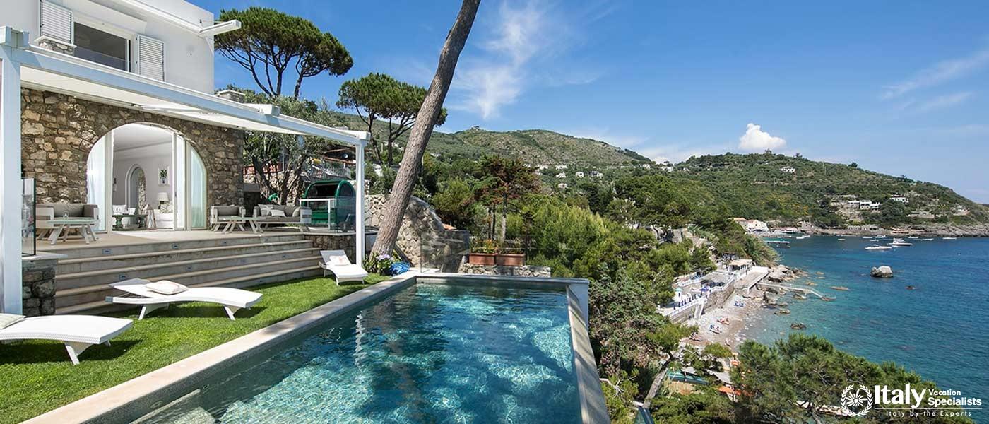 Luxurious villa with a pool and stunning coastal view.