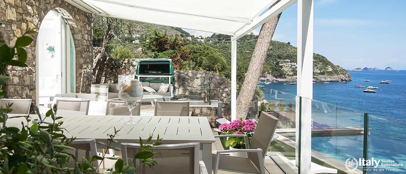 Outdoor dining area with picturesque sea view.