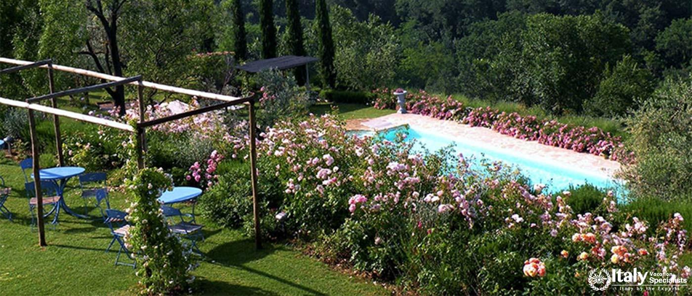 Garden seating area by the pool near Florence, Italy.