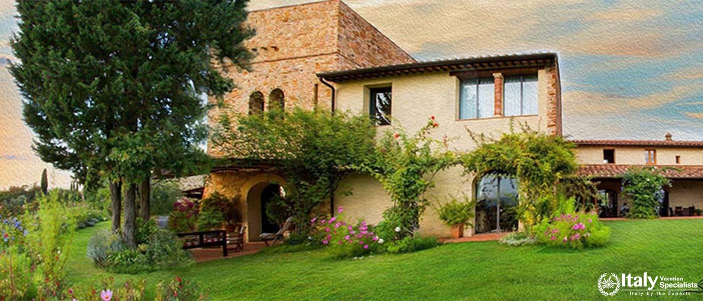  Verdant garden with stone villa and shaded seating area.