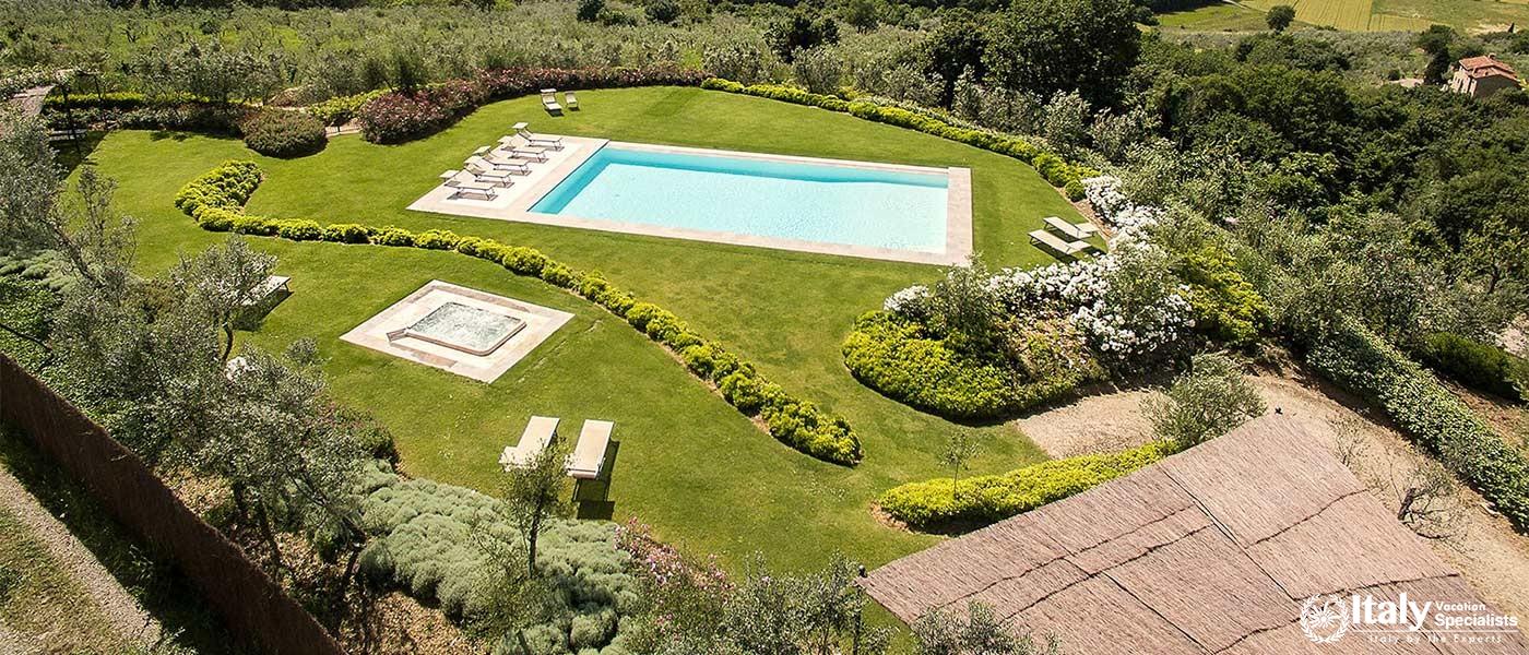 Aerial shot of the landscaped garden and pool area.