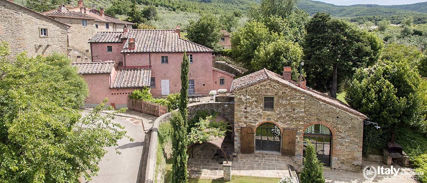 View of the villa's exterior with traditional Tuscan architecture.