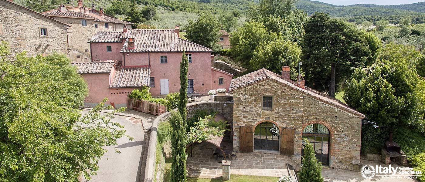 View of the villa's exterior with traditional Tuscan architecture.